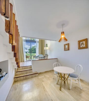 a room with a table and chairs