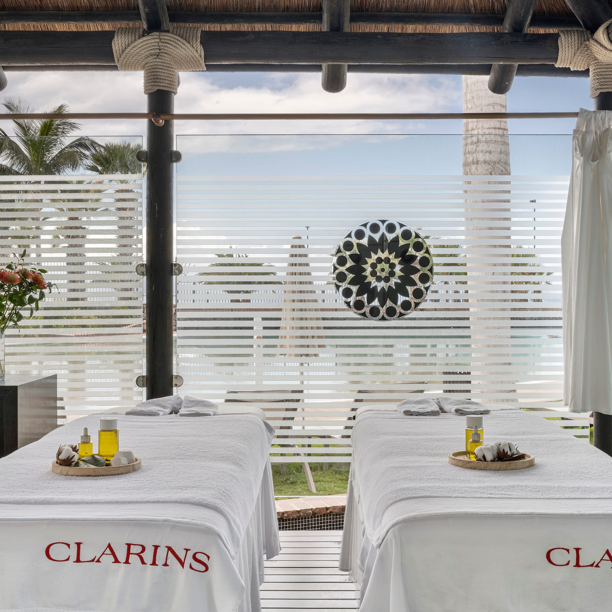 a massage tables with white sheets on it