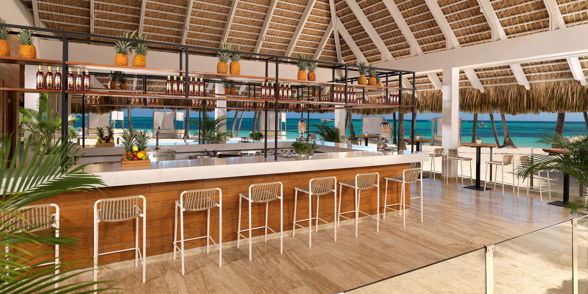 a bar with a shelf and chairs in a tropical setting