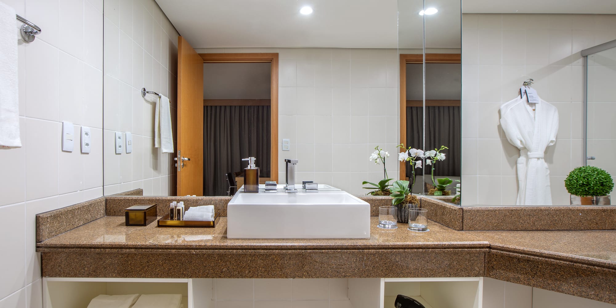 a bathroom with a sink and mirror