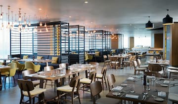 a restaurant with tables and chairs