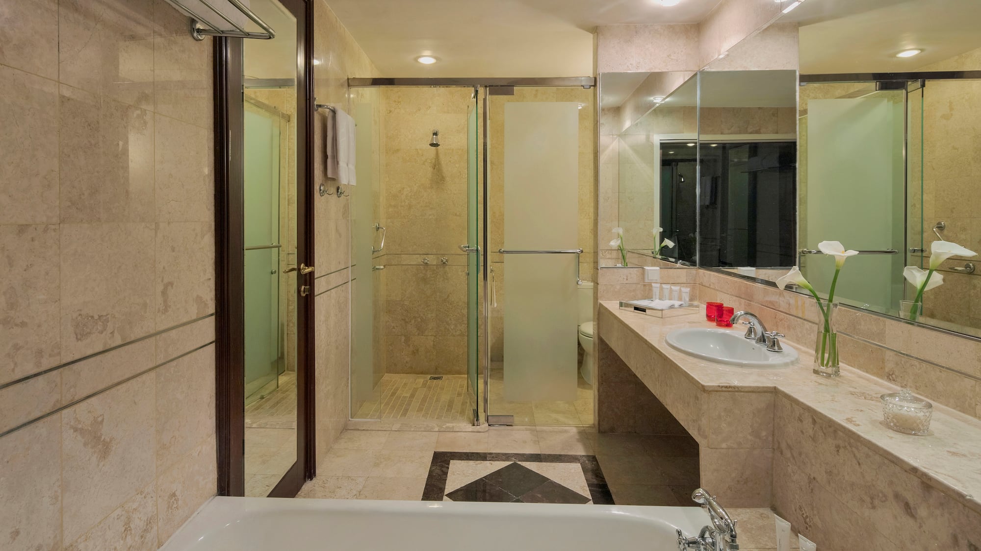 a bathroom with a bathtub and shower