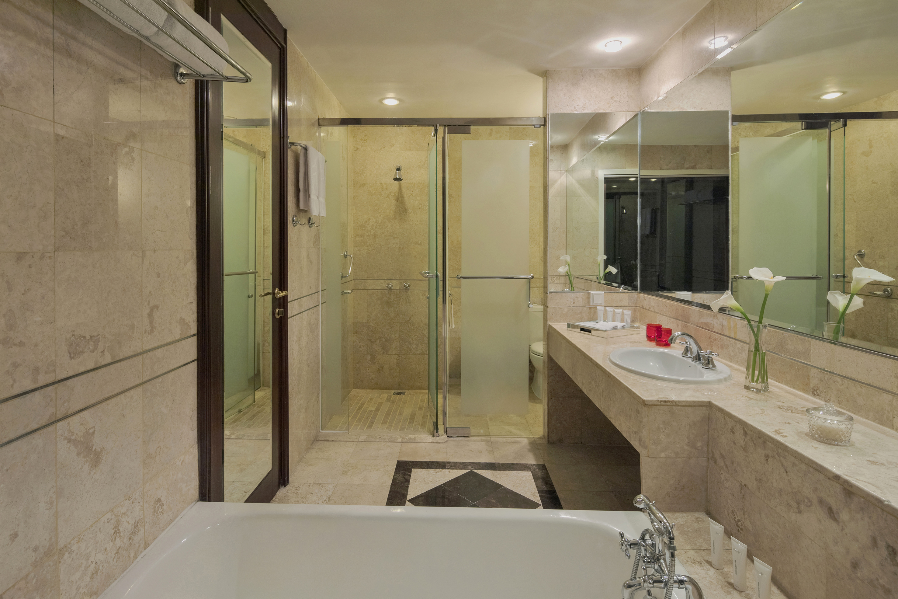 a bathroom with a bathtub and shower
