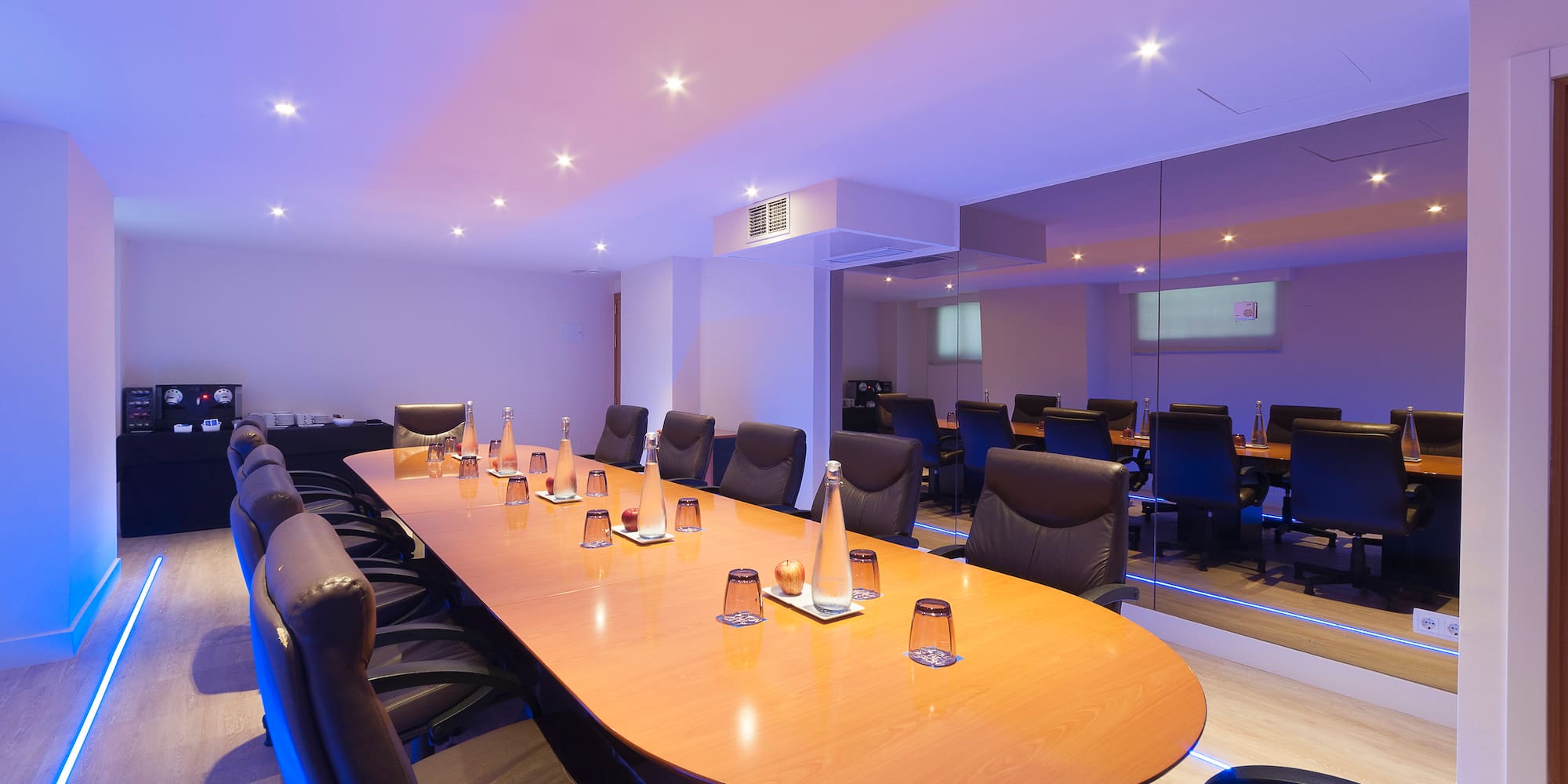 a conference room with a table and chairs
