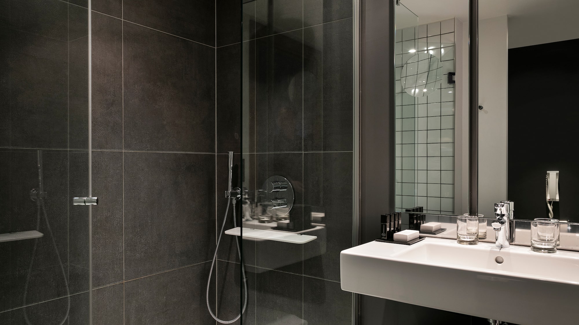 a bathroom with a glass shower door