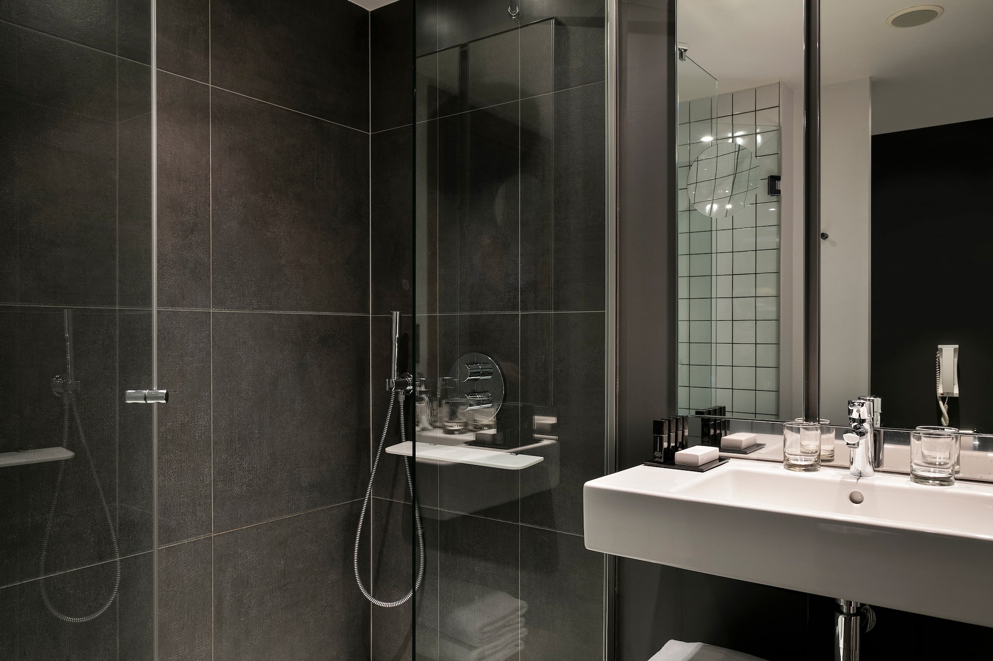 a bathroom with a glass shower door
