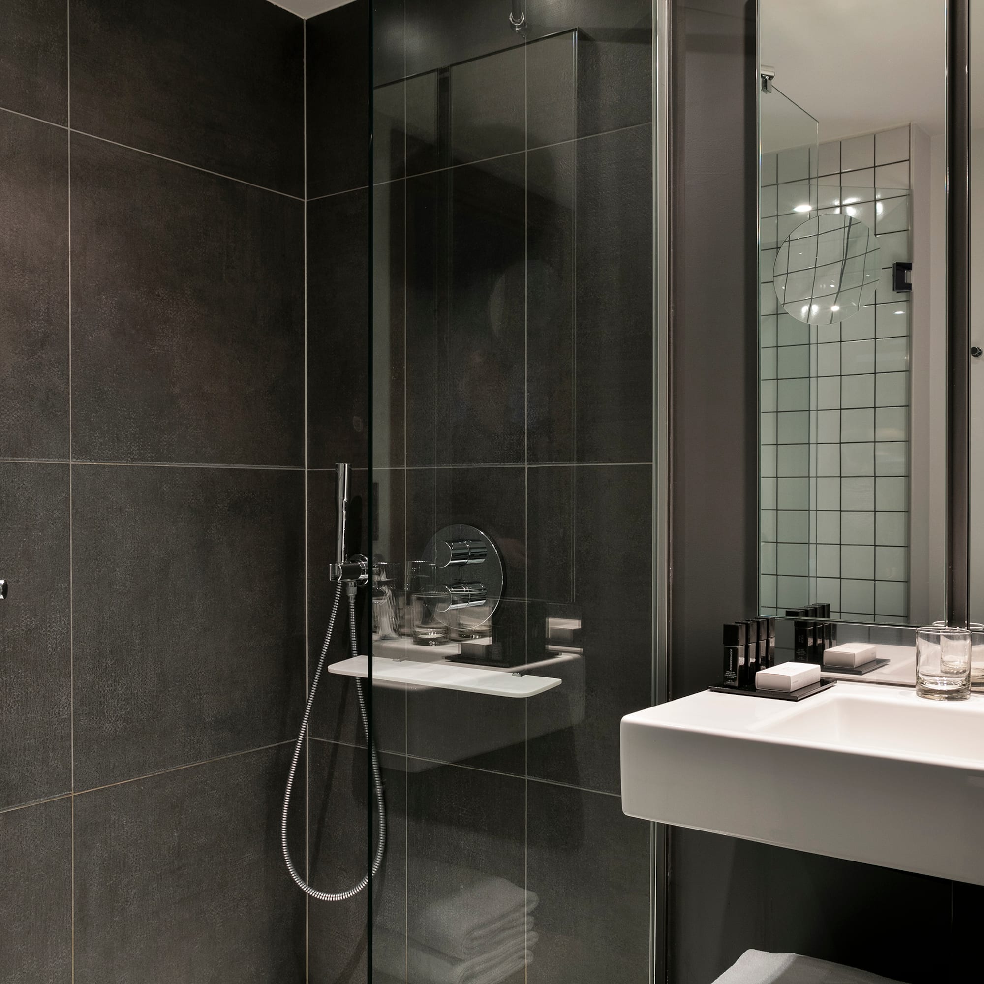 a bathroom with a glass shower door