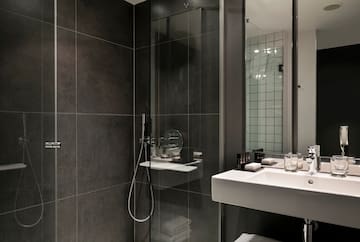 a bathroom with a glass shower door