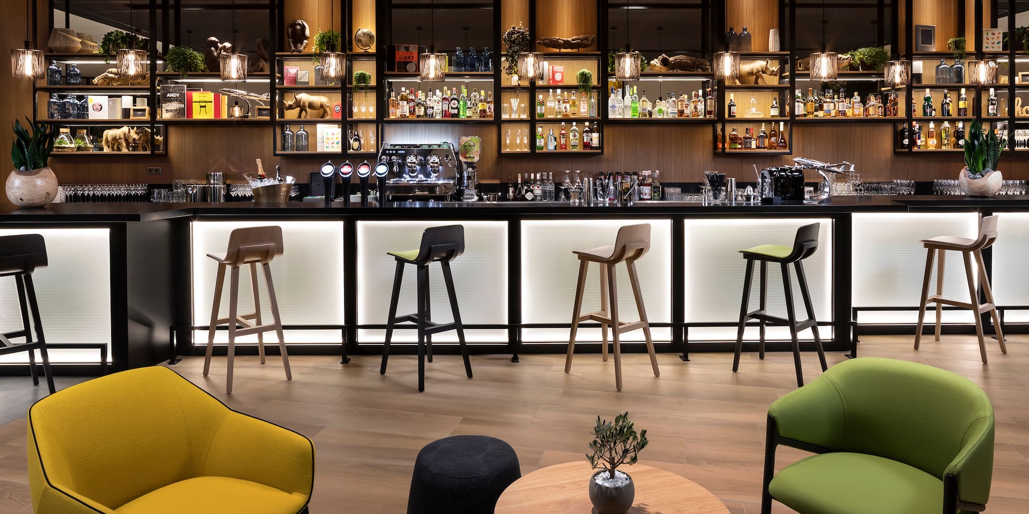 a bar with a counter and chairs