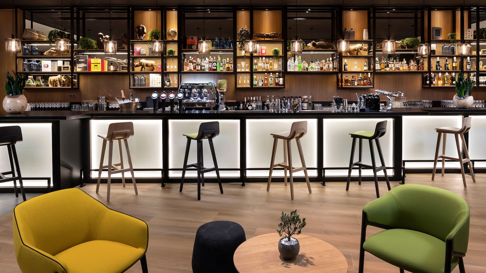 a bar with a counter and chairs