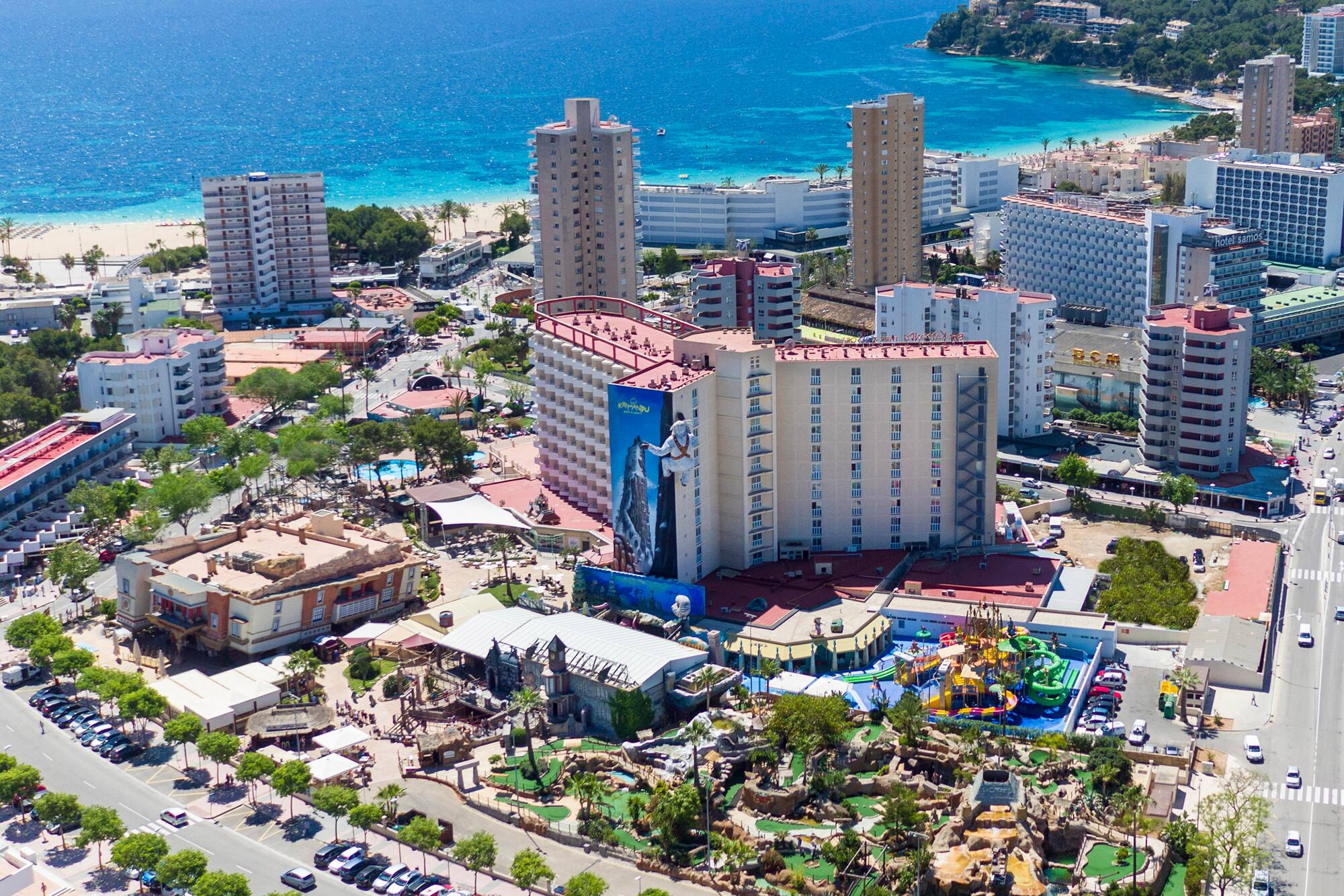 a city with buildings and a beach