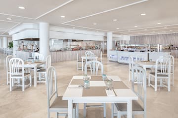 a restaurant with tables and chairs