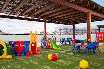 a playground with colorful toys and tables
