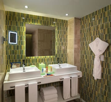 a bathroom with a mirror and sink