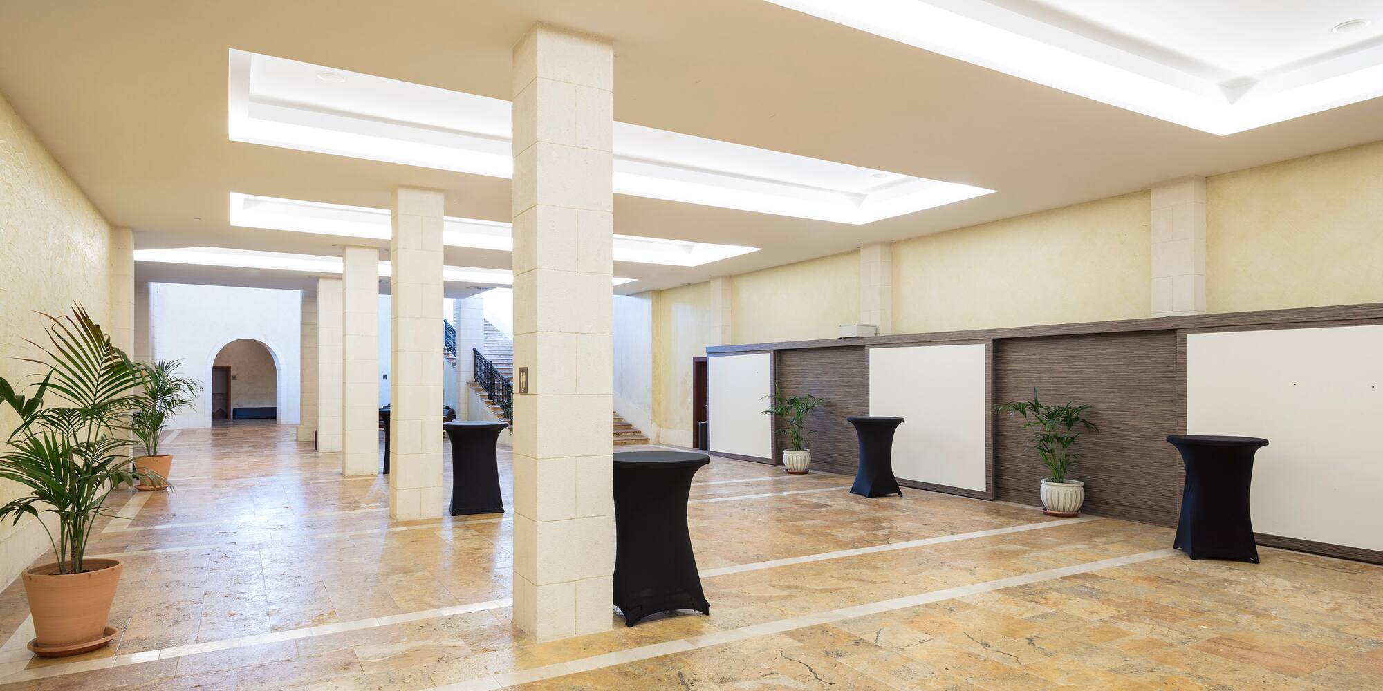 a room with columns and tables