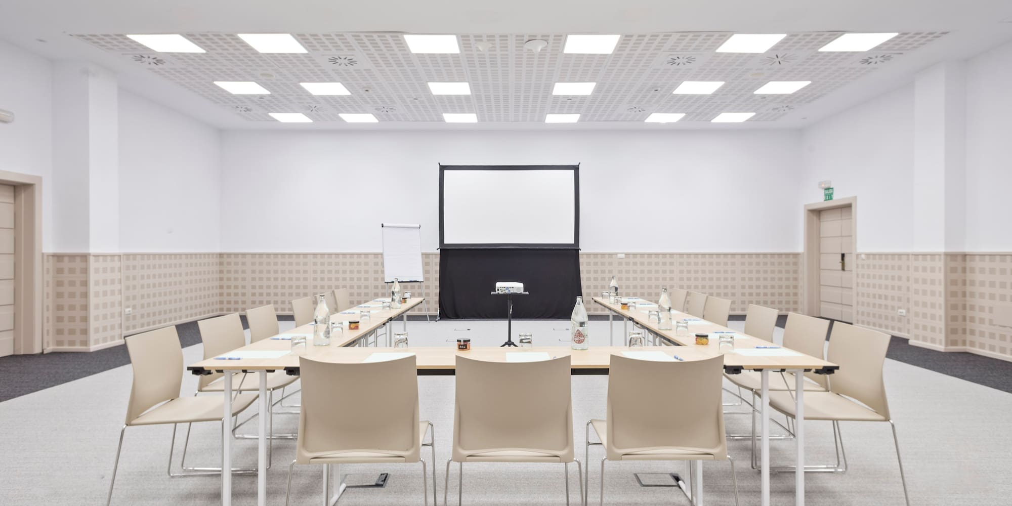 a room with a large table and chairs
