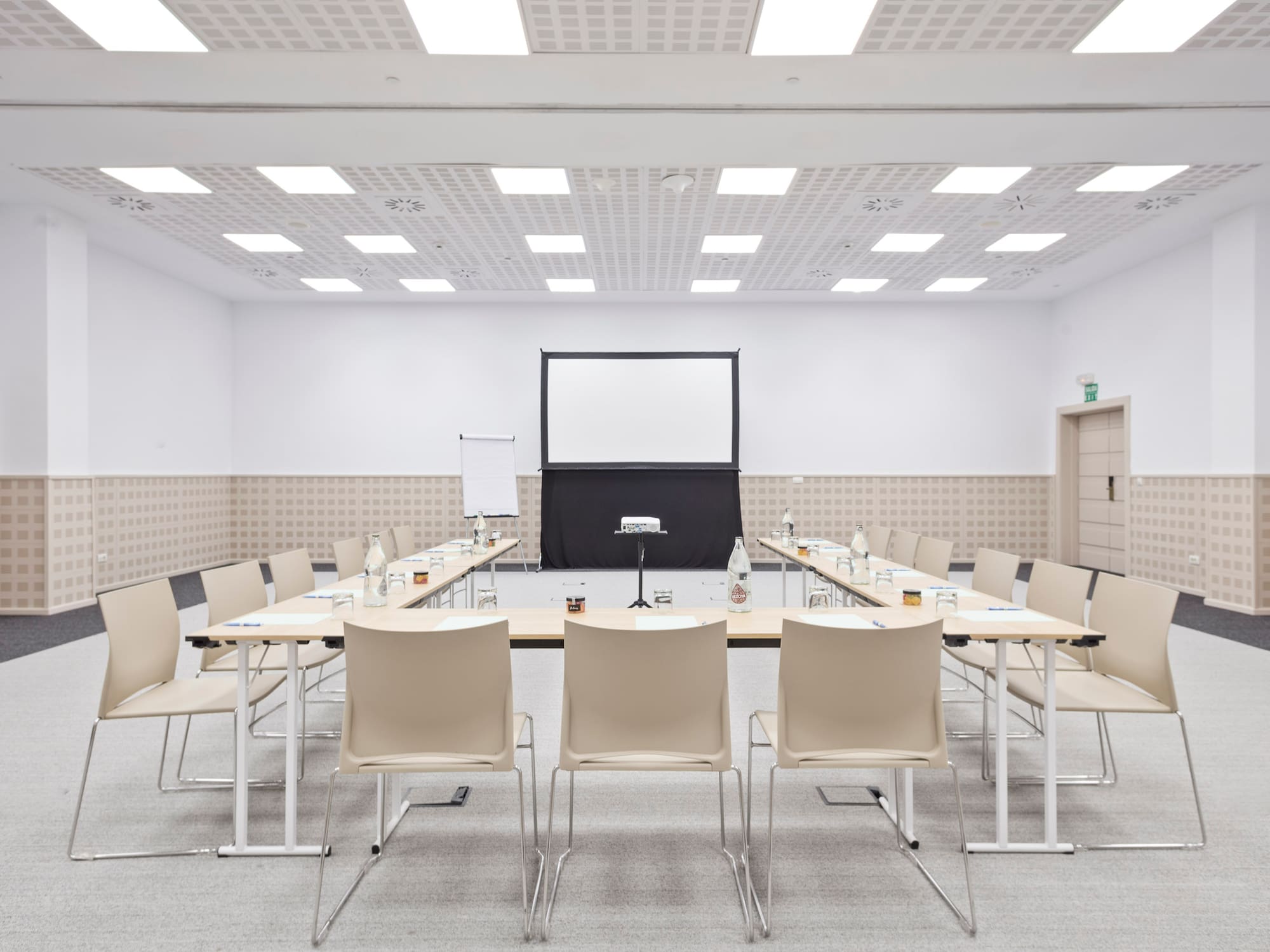a room with a large table and chairs