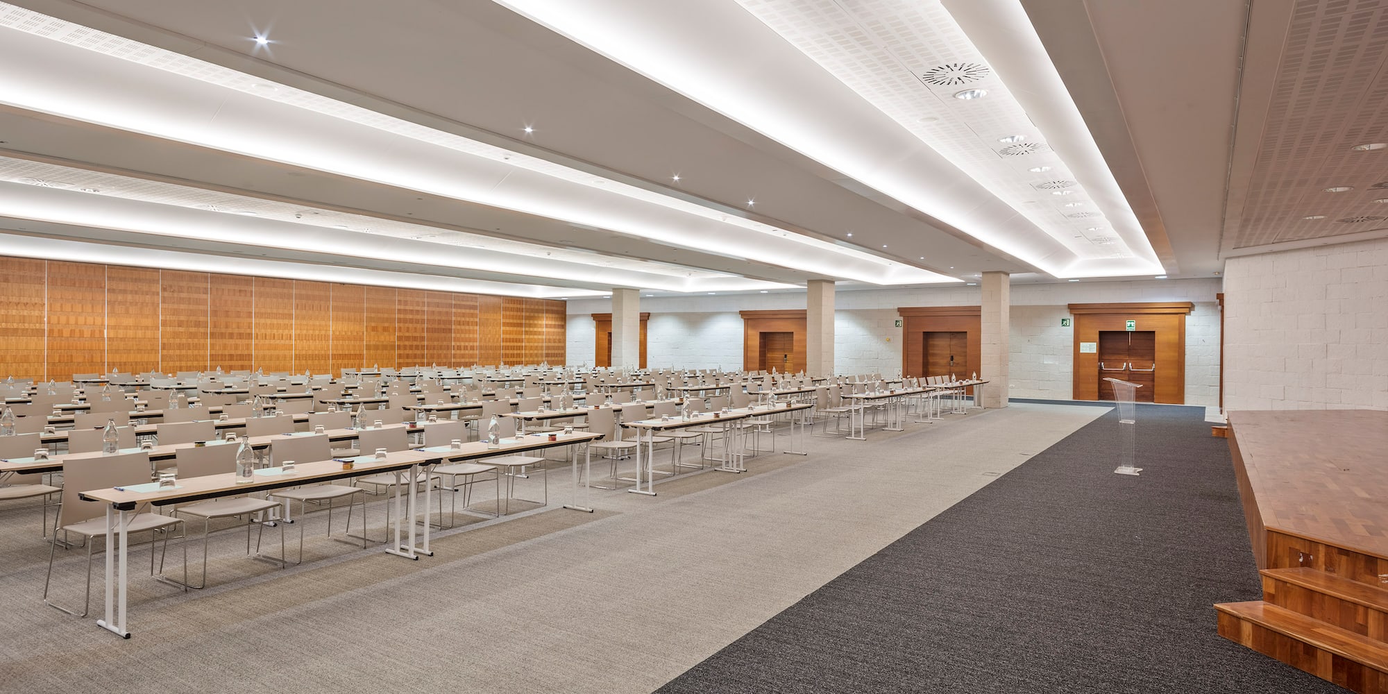 a room with many tables and chairs