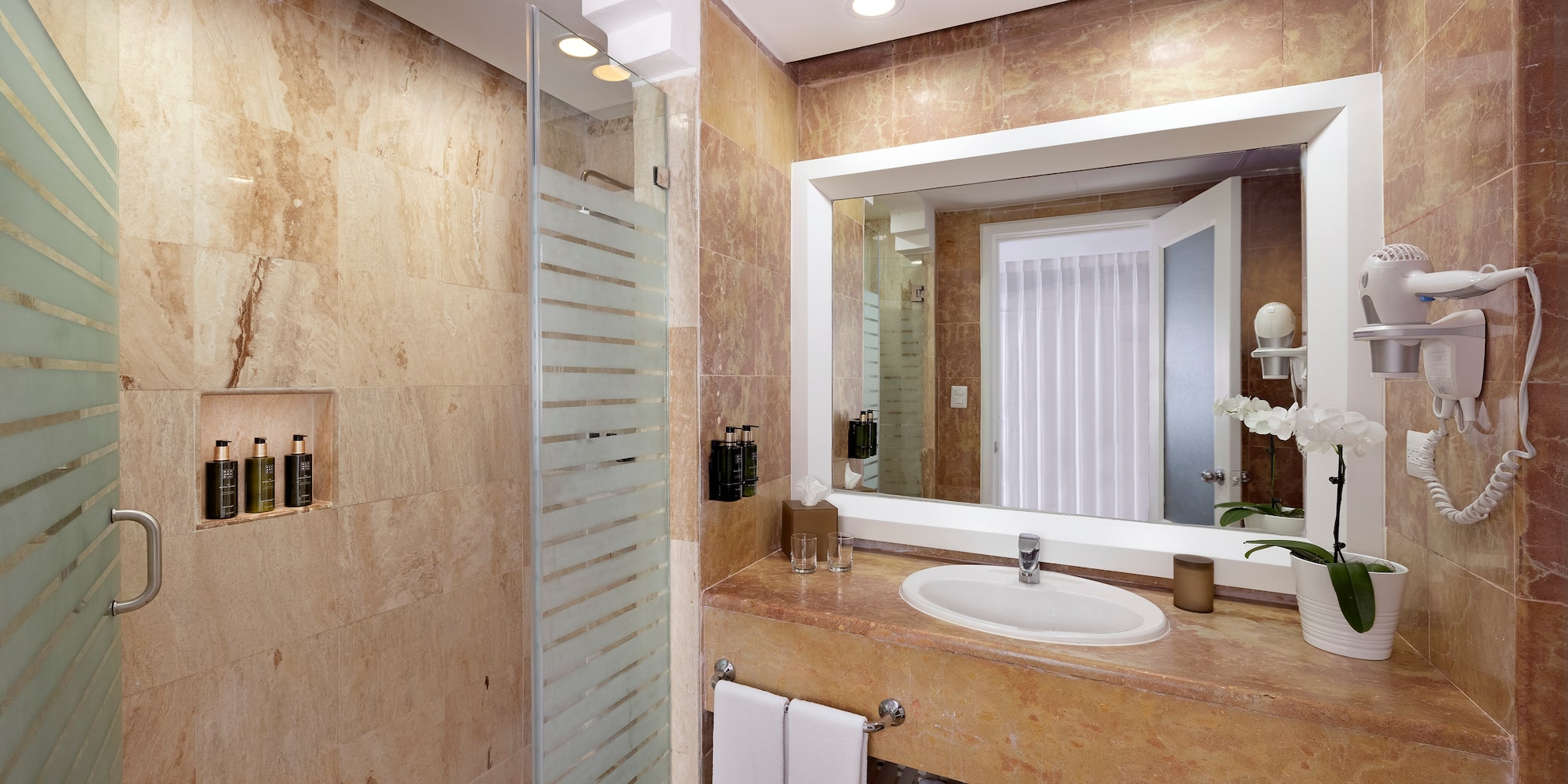 a bathroom with a mirror and sink