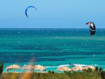 a person kite surfing on the ocean