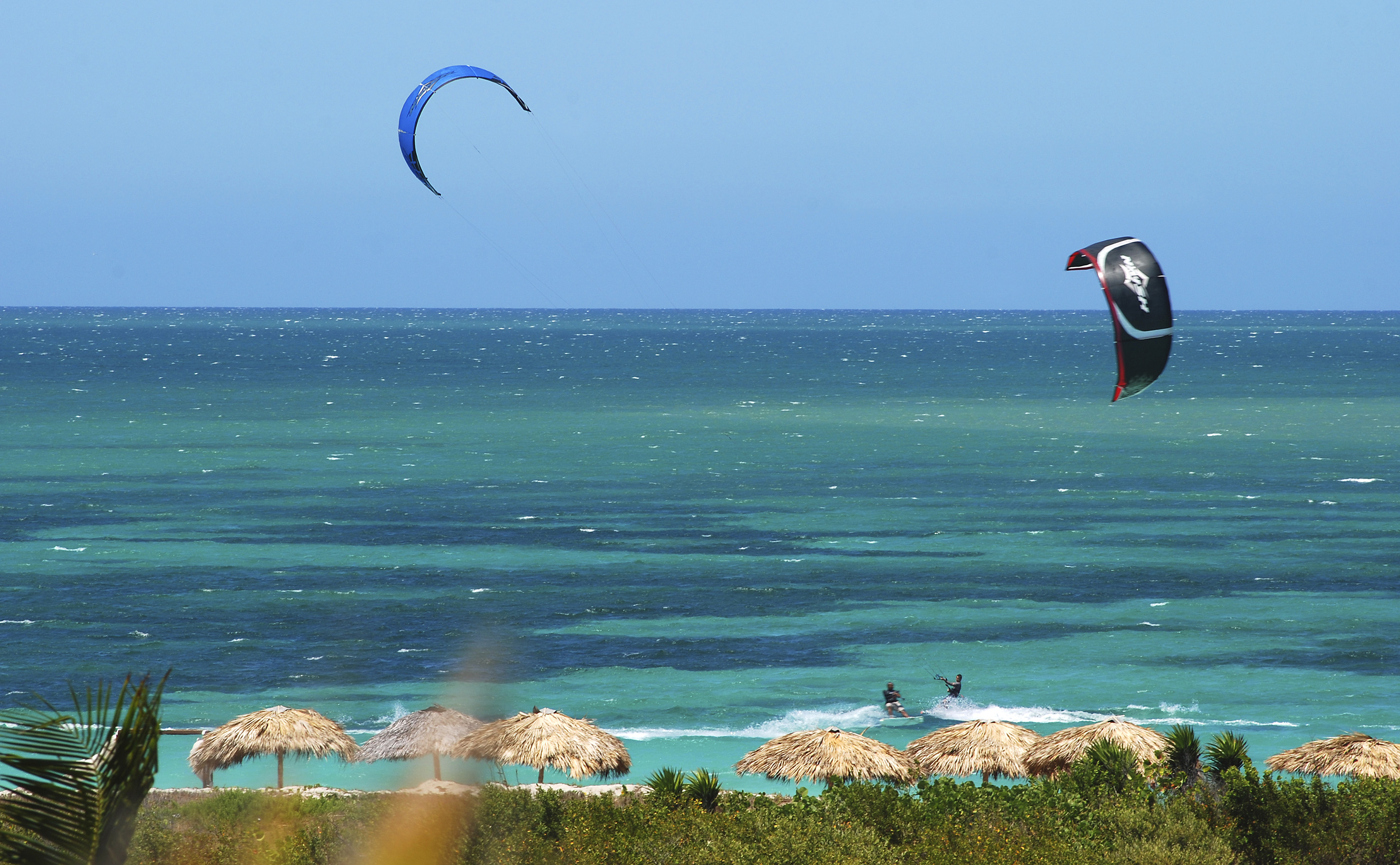 a person kite surfing on the ocean