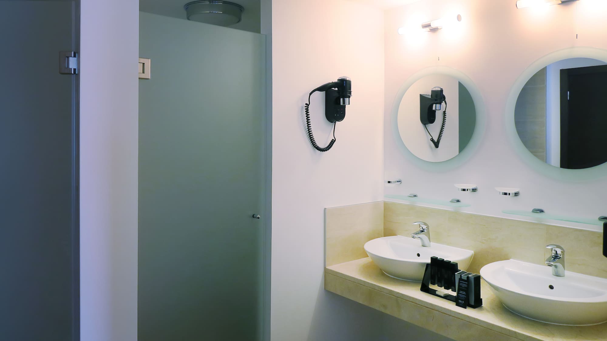 a bathroom with a mirror and sink