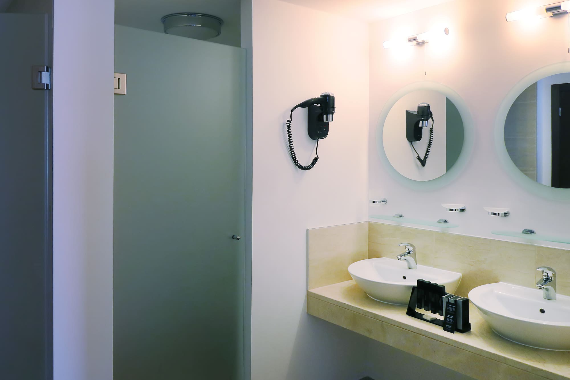 a bathroom with a mirror and sink