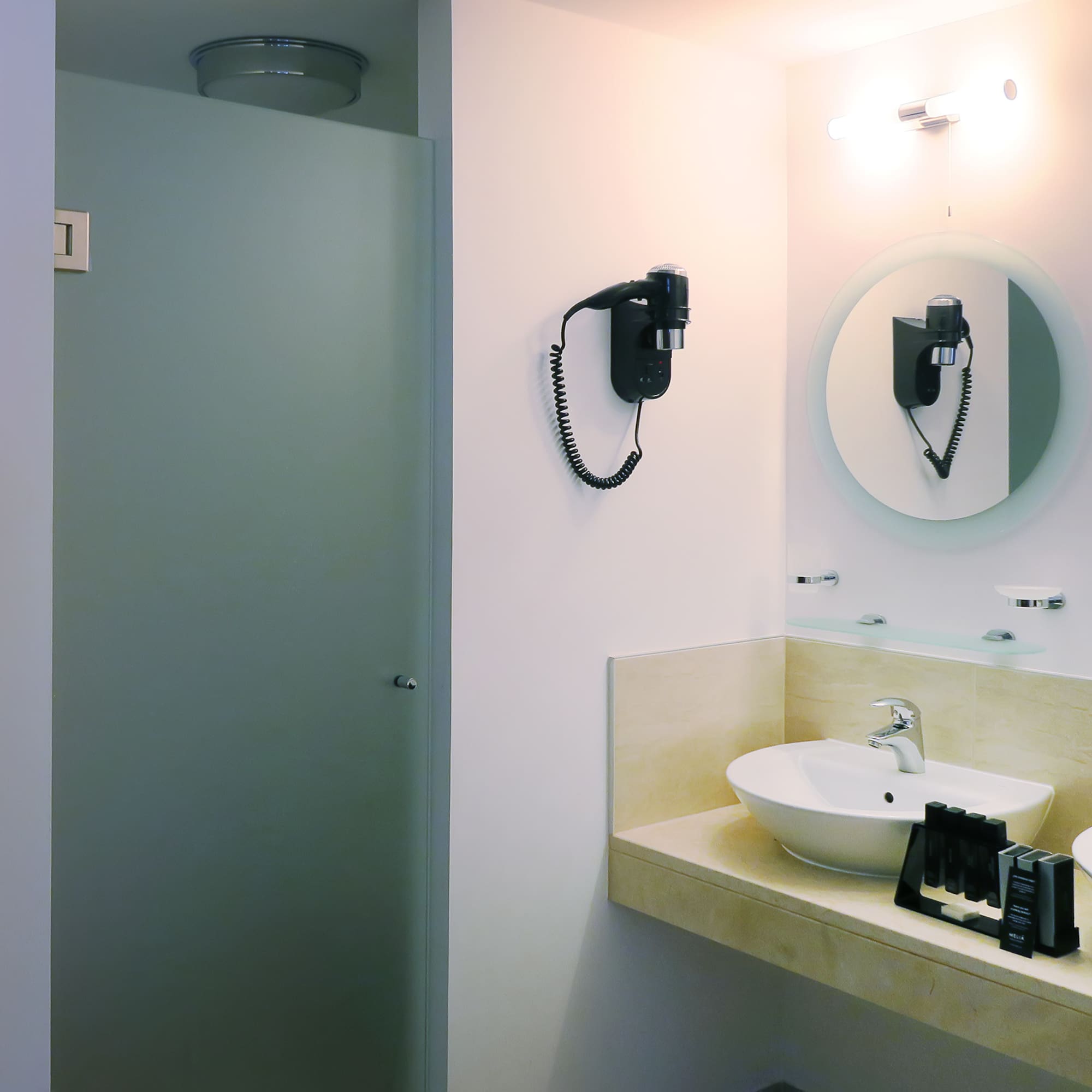 a bathroom with a mirror and sink