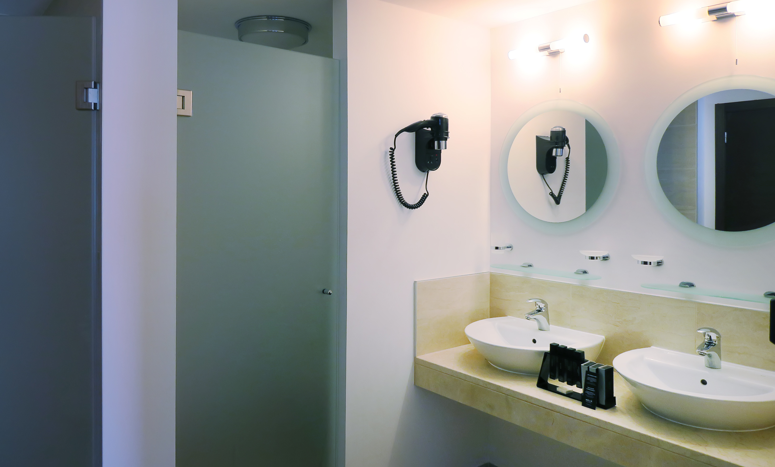 a bathroom with a mirror and sink