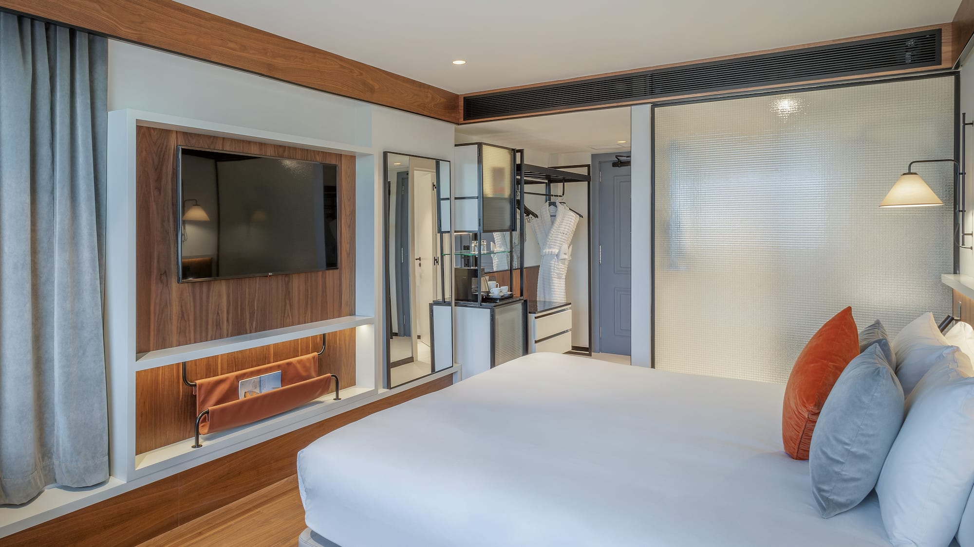 a room with a bed and a tv