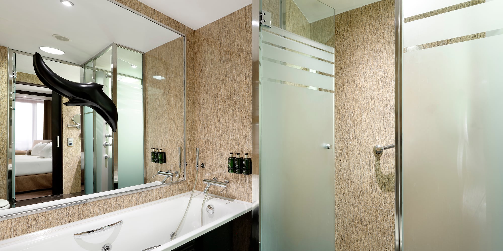 a bathroom with a bathtub and shower