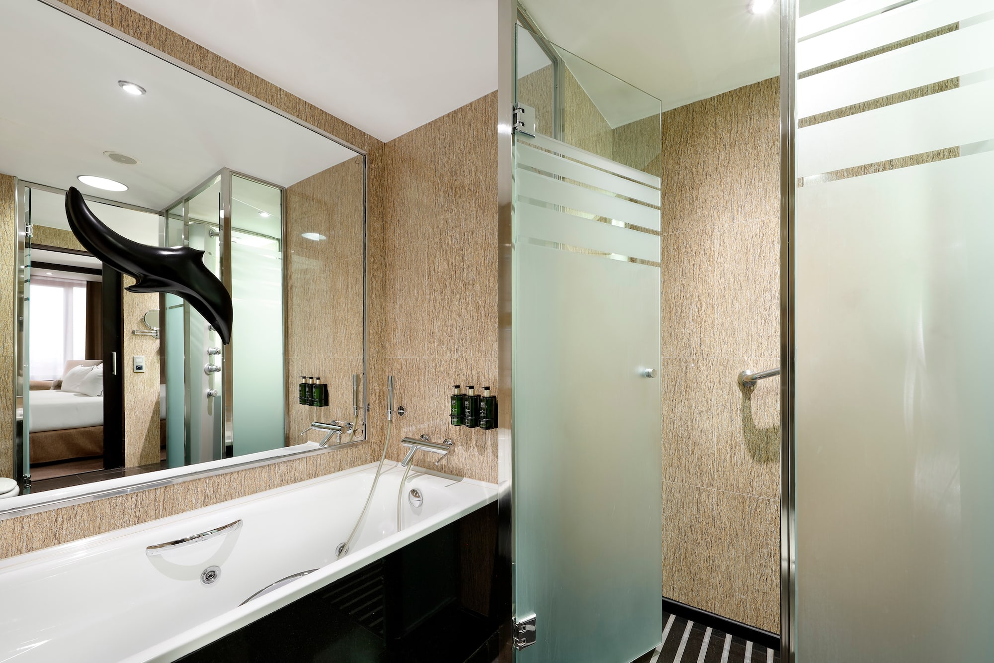 a bathroom with a bathtub and shower