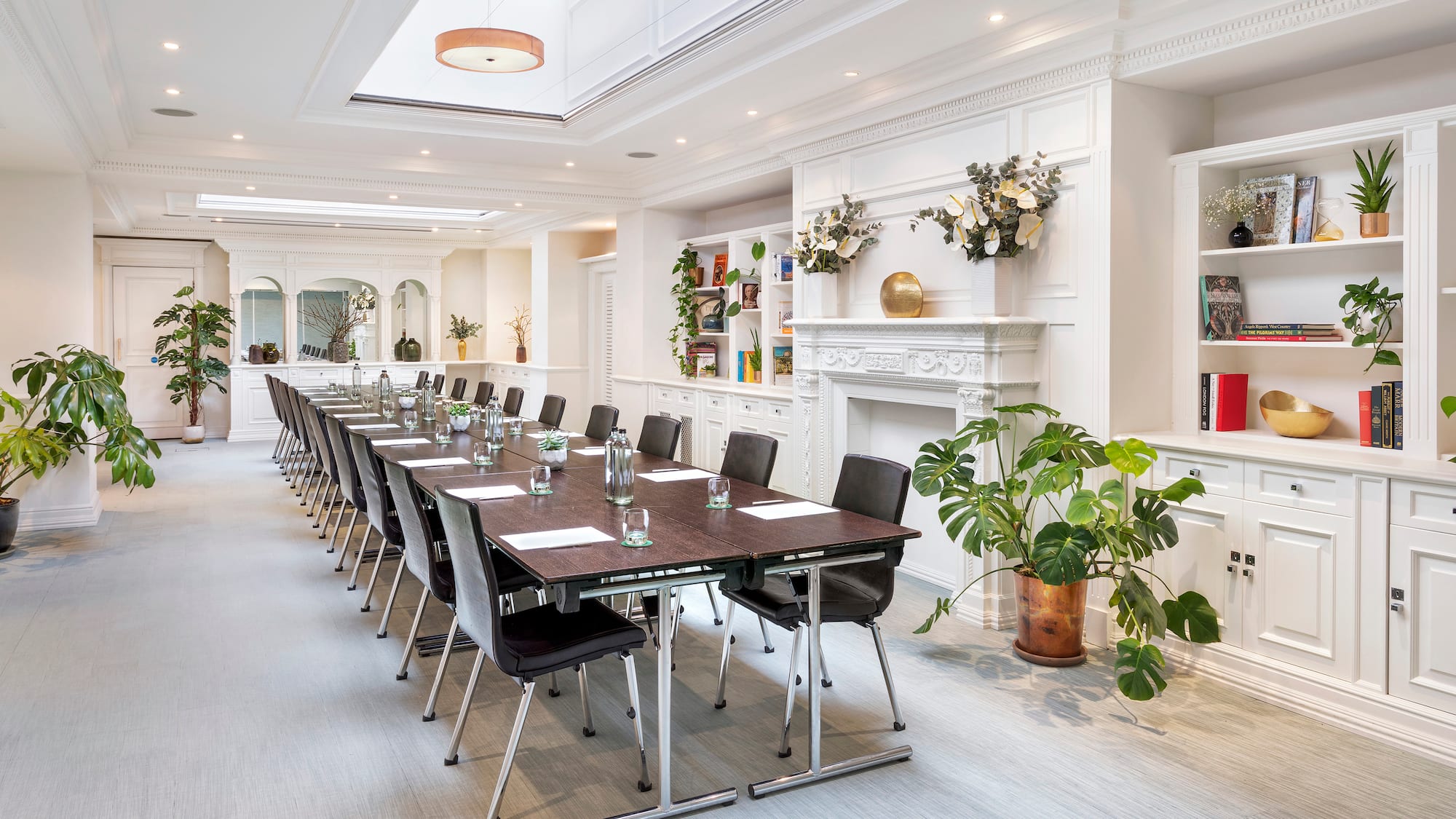 a long conference room with a long table and chairs