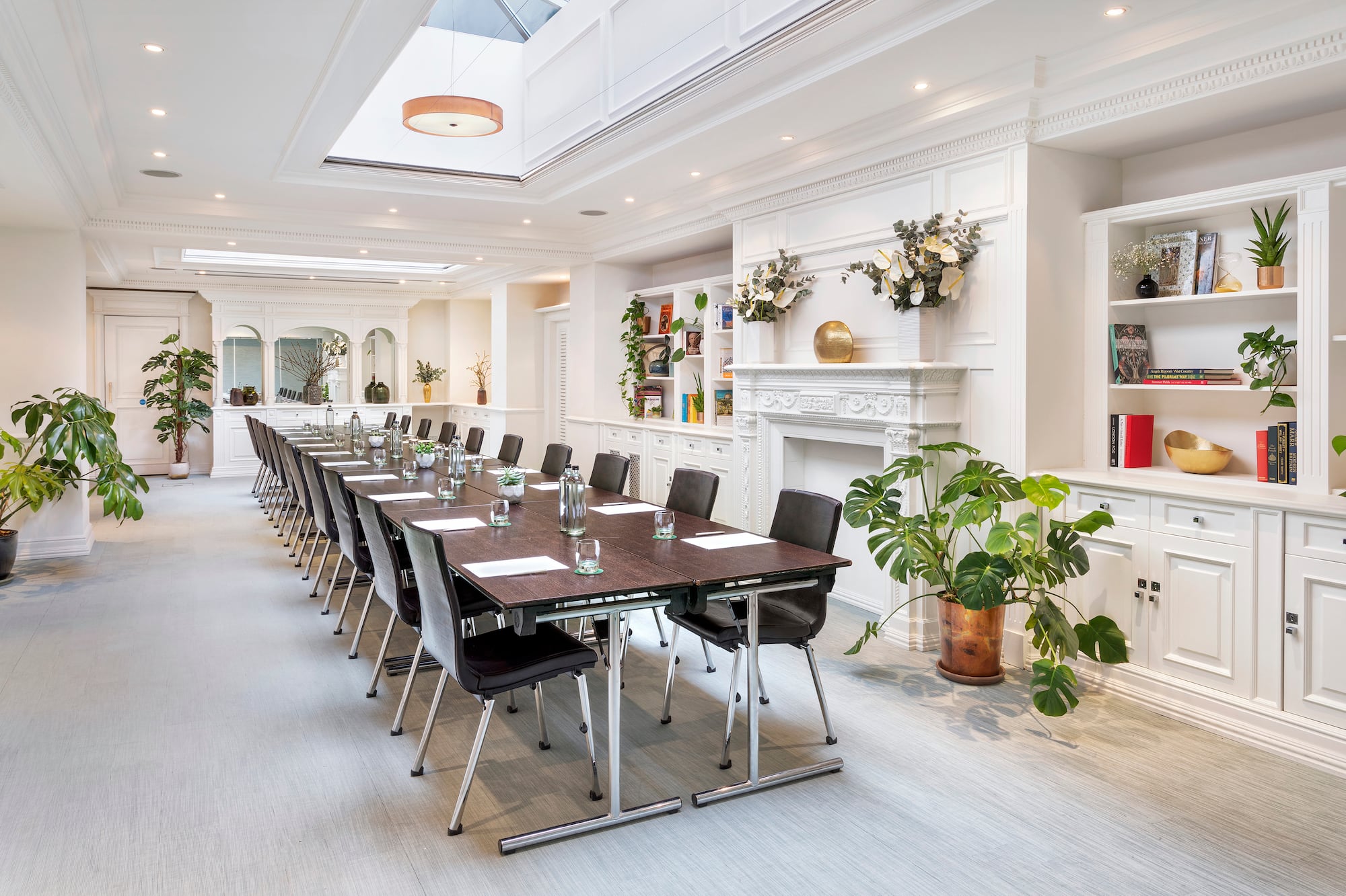 a long conference room with a long table and chairs