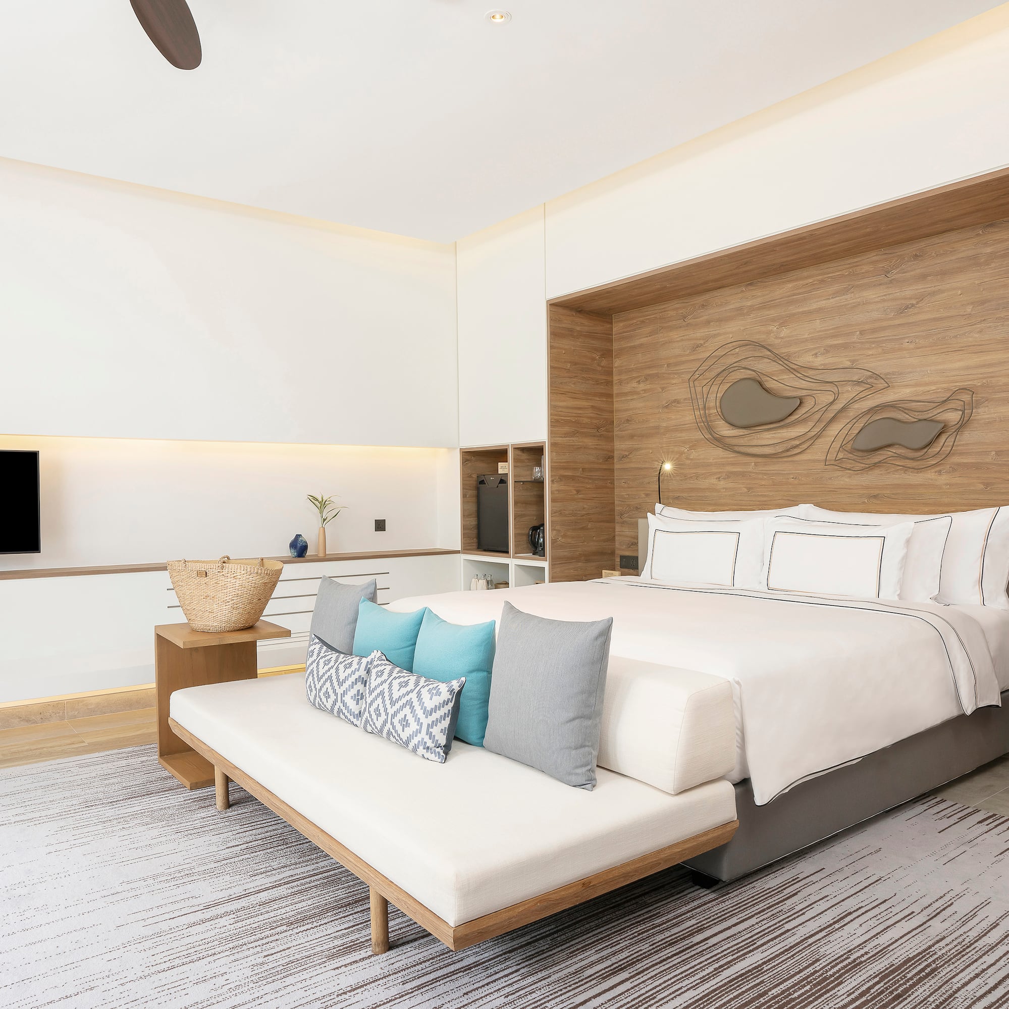 a bedroom with a bed and a tv