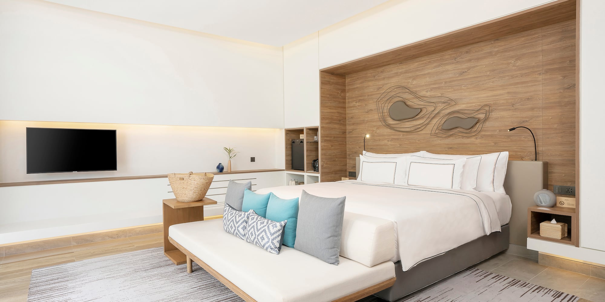 a bedroom with a bed and a tv