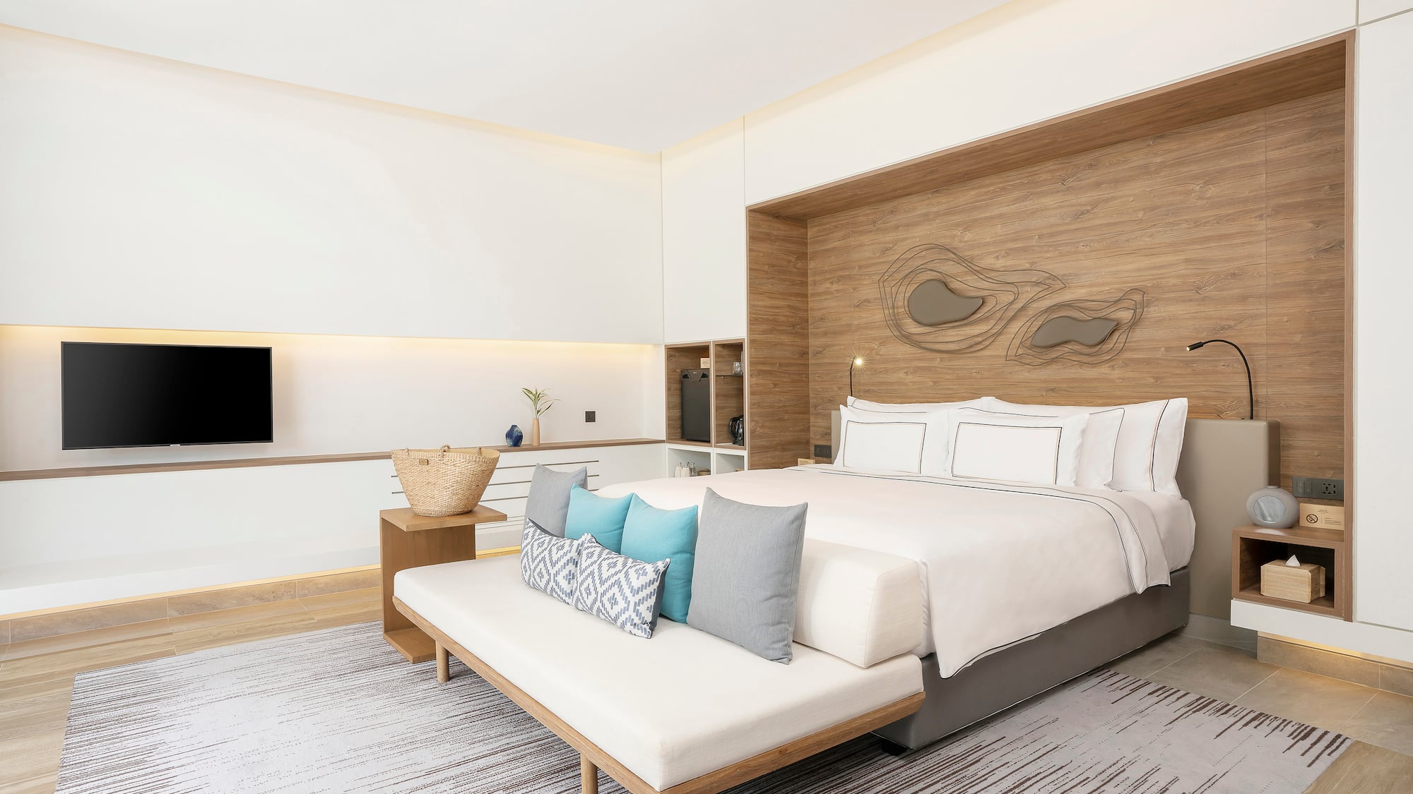 a bedroom with a bed and a tv