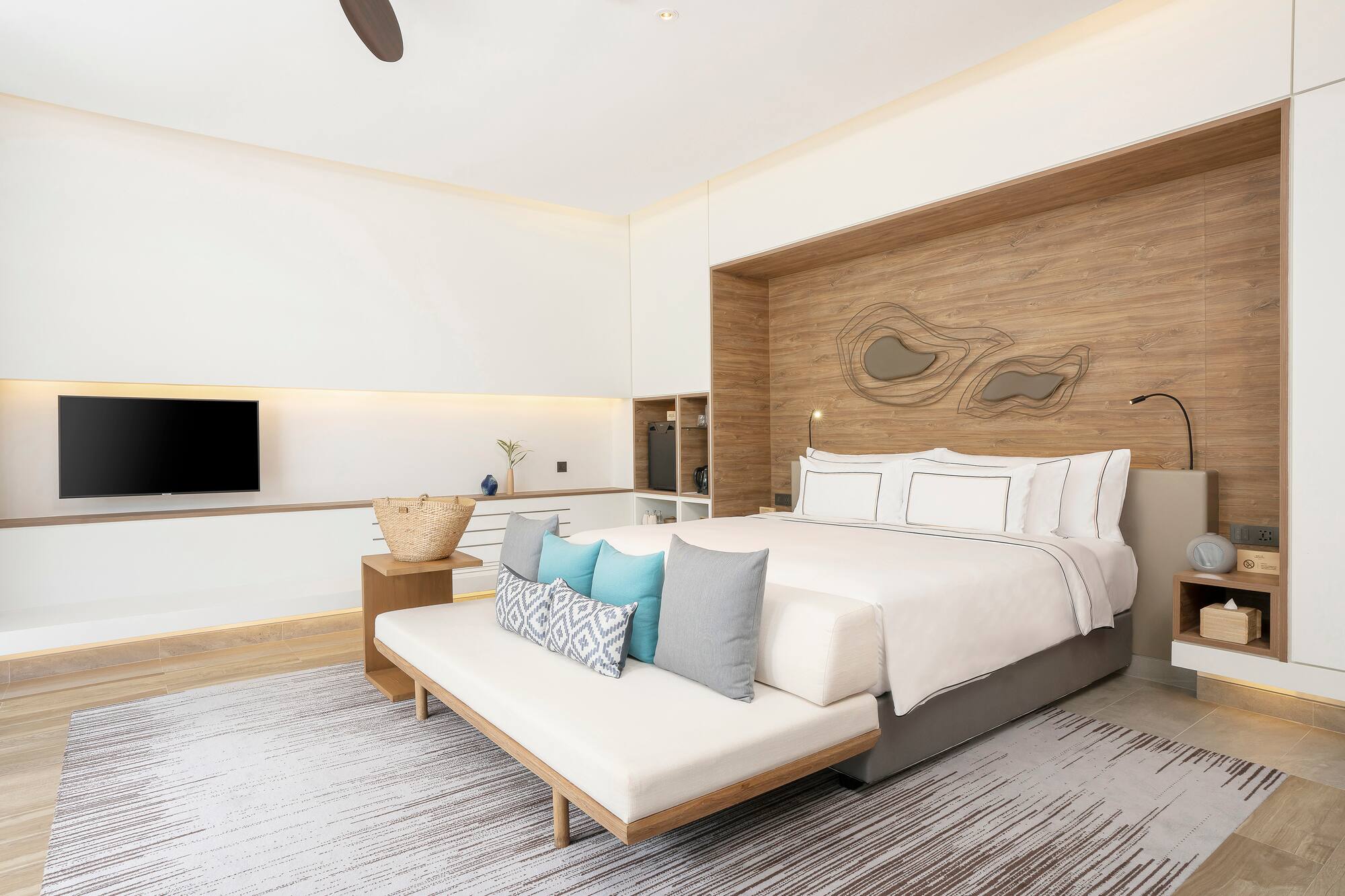 a bedroom with a bed and a tv