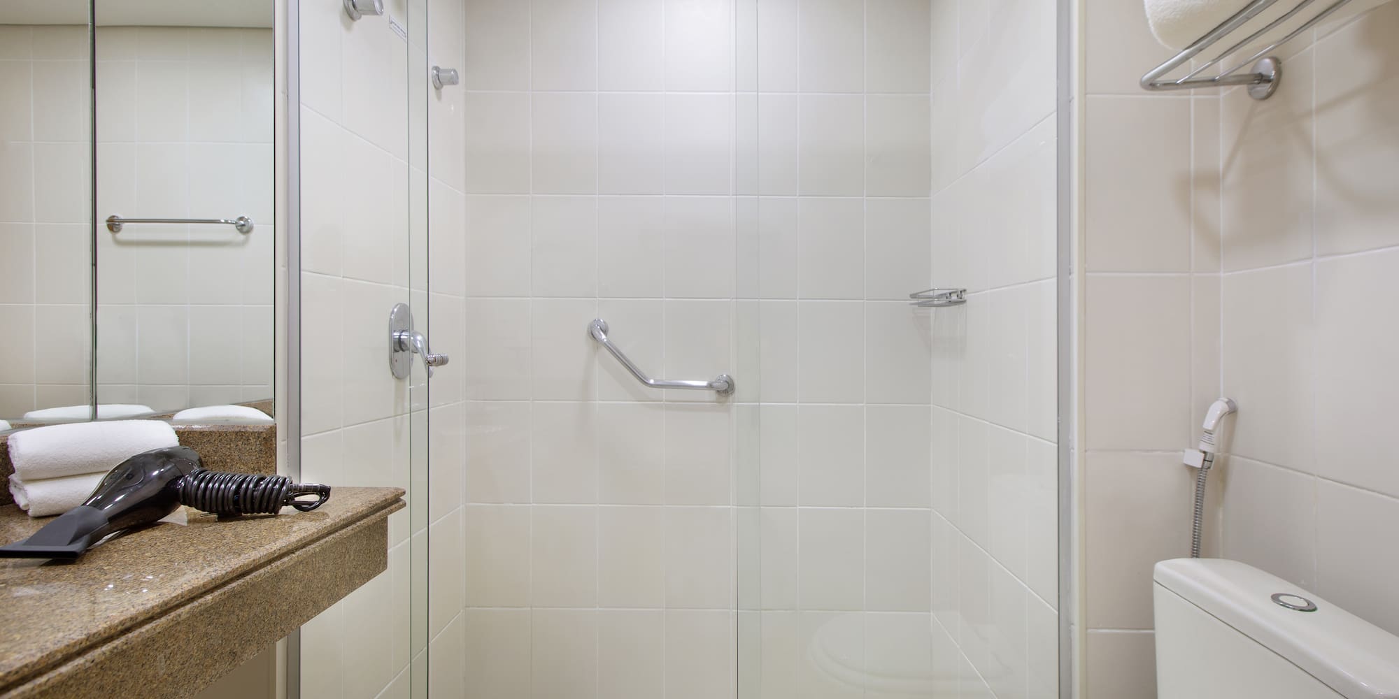 a bathroom with a shower and toilet