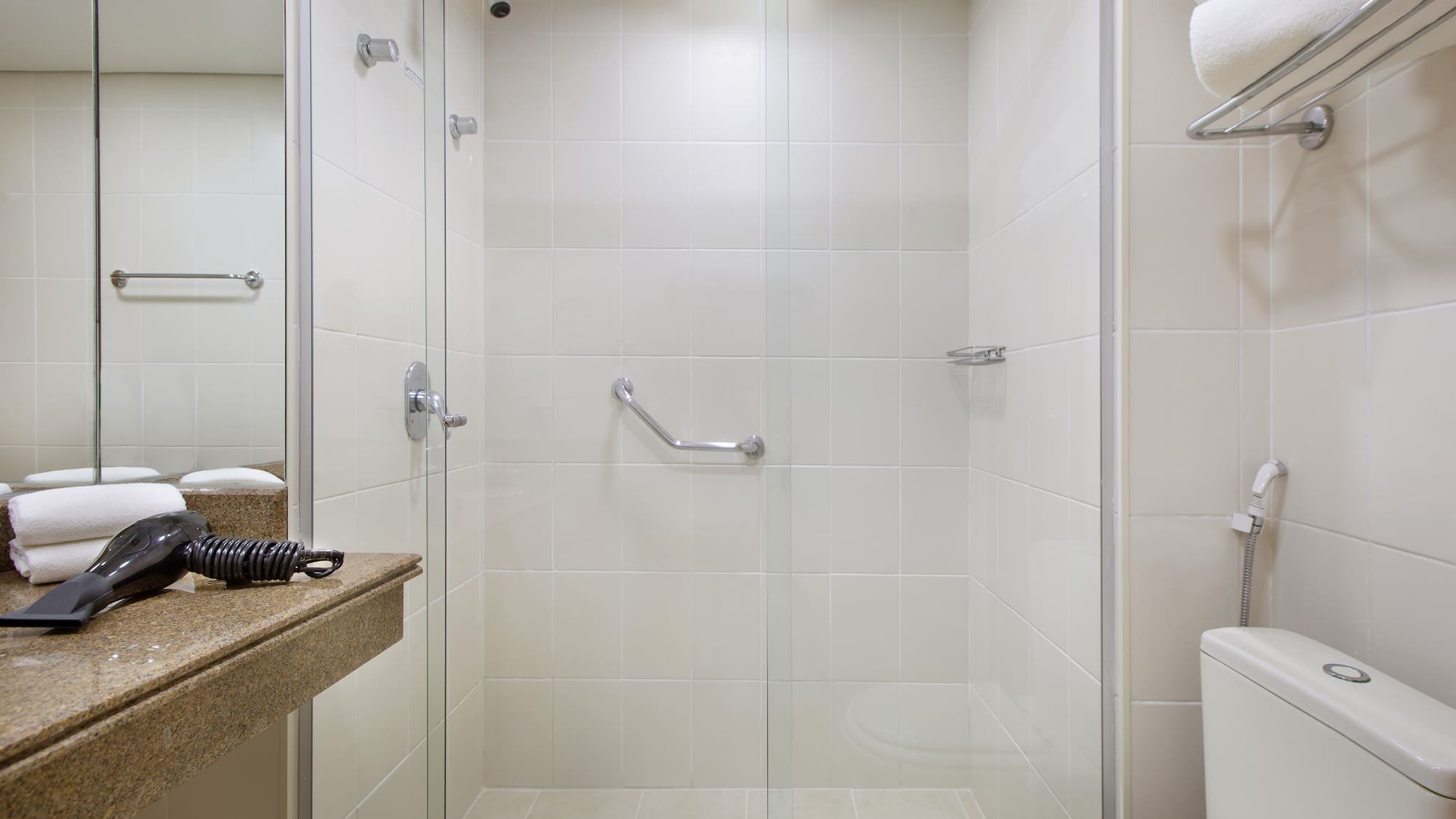 a bathroom with a shower and toilet