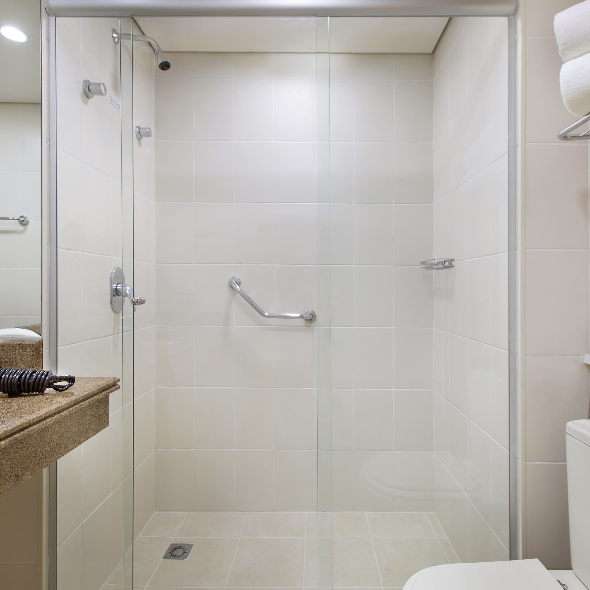 a bathroom with a shower and toilet
