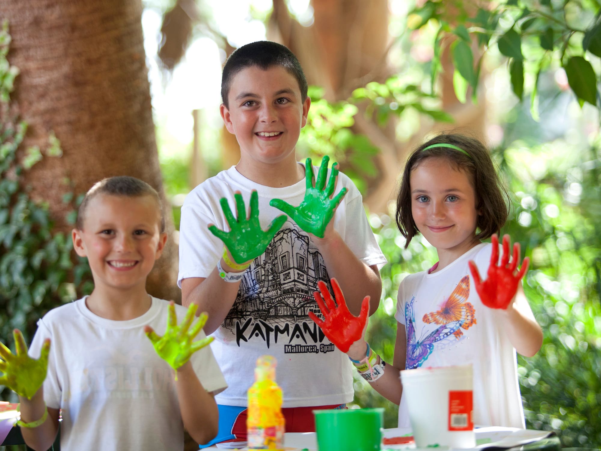 a group of children with painted hands