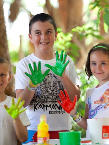 a group of children with painted hands