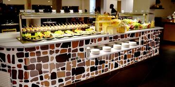 a buffet with plates of food
