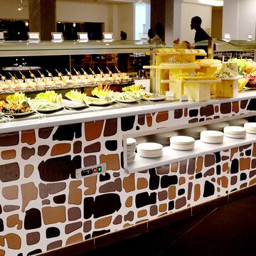 a buffet with plates of food