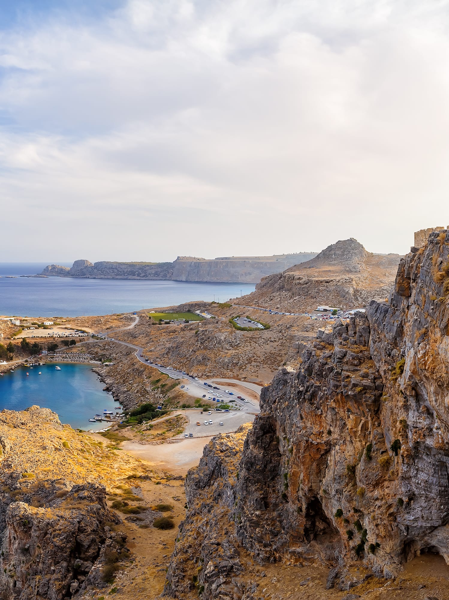 a rocky cliff with a castle on it