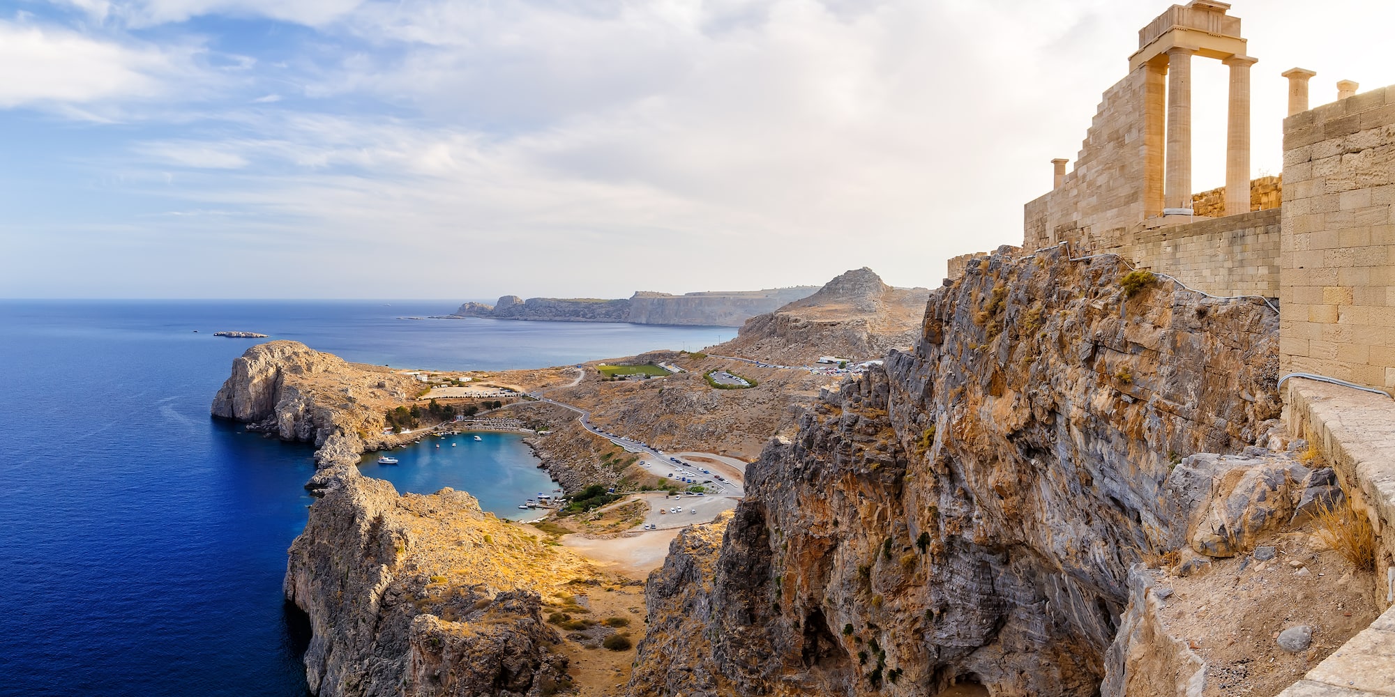 a rocky cliff with a castle on it