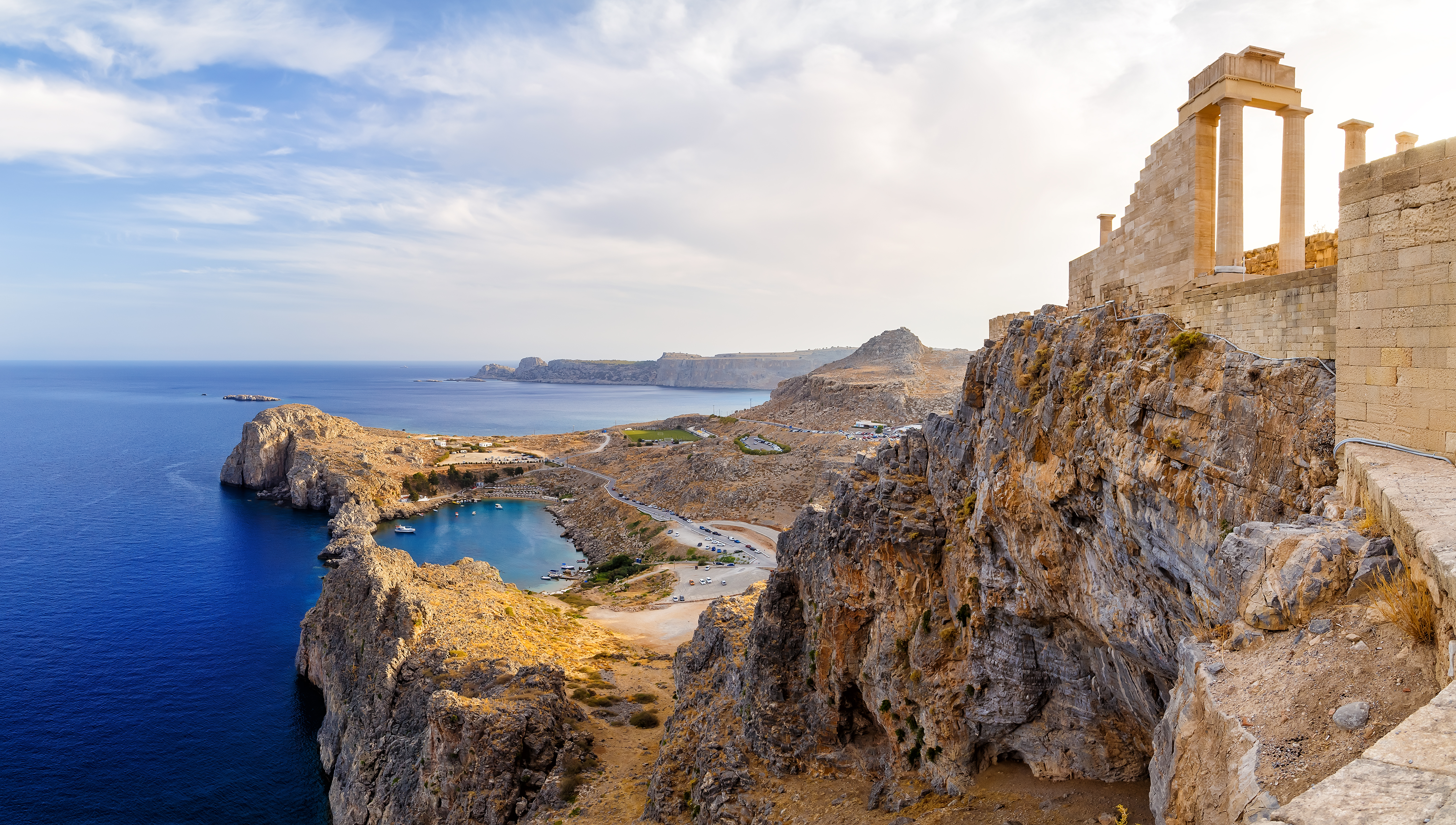 a rocky cliff with a castle on it