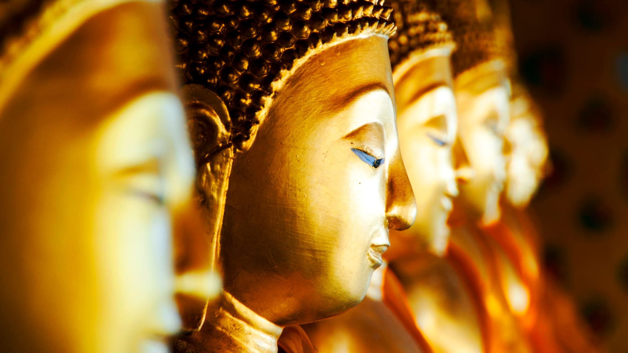 a row of gold statues