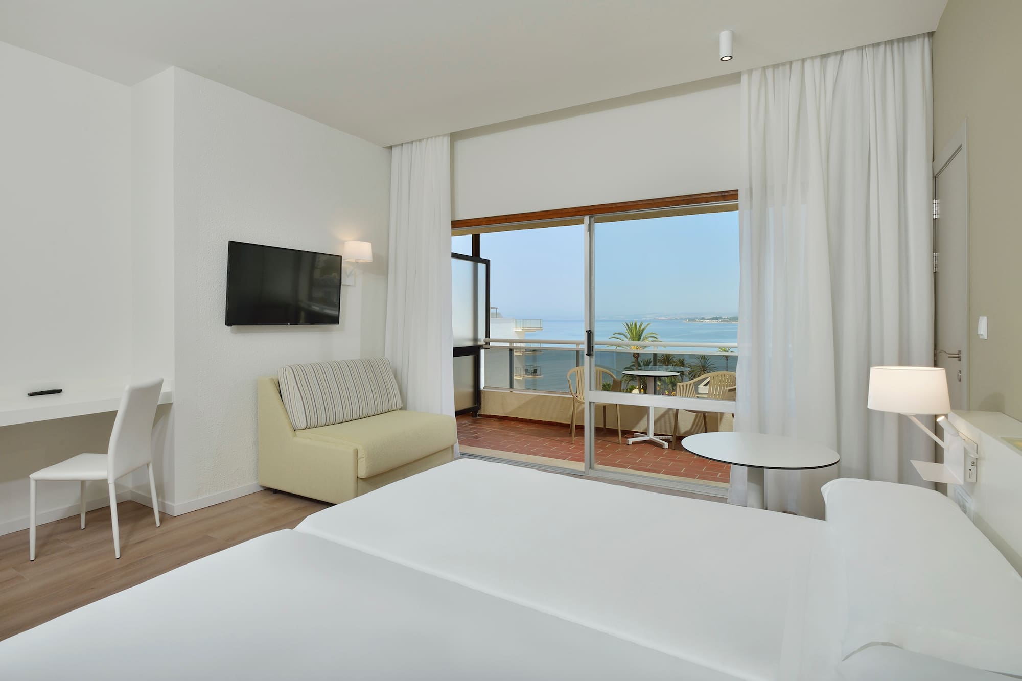 a room with a television and a bed